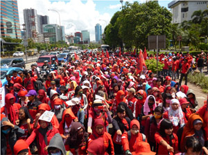 Indonesian workers flood out onto the streets of Bekasi near Jakarta, which is being staken by a strike wave